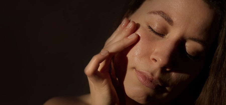 Woman stroking her face