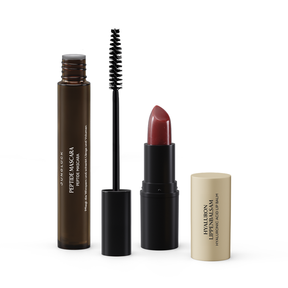 Beauty Essentials-set van rozenhout met een peptidemasker, mascara en lippenstift in warme tinten.