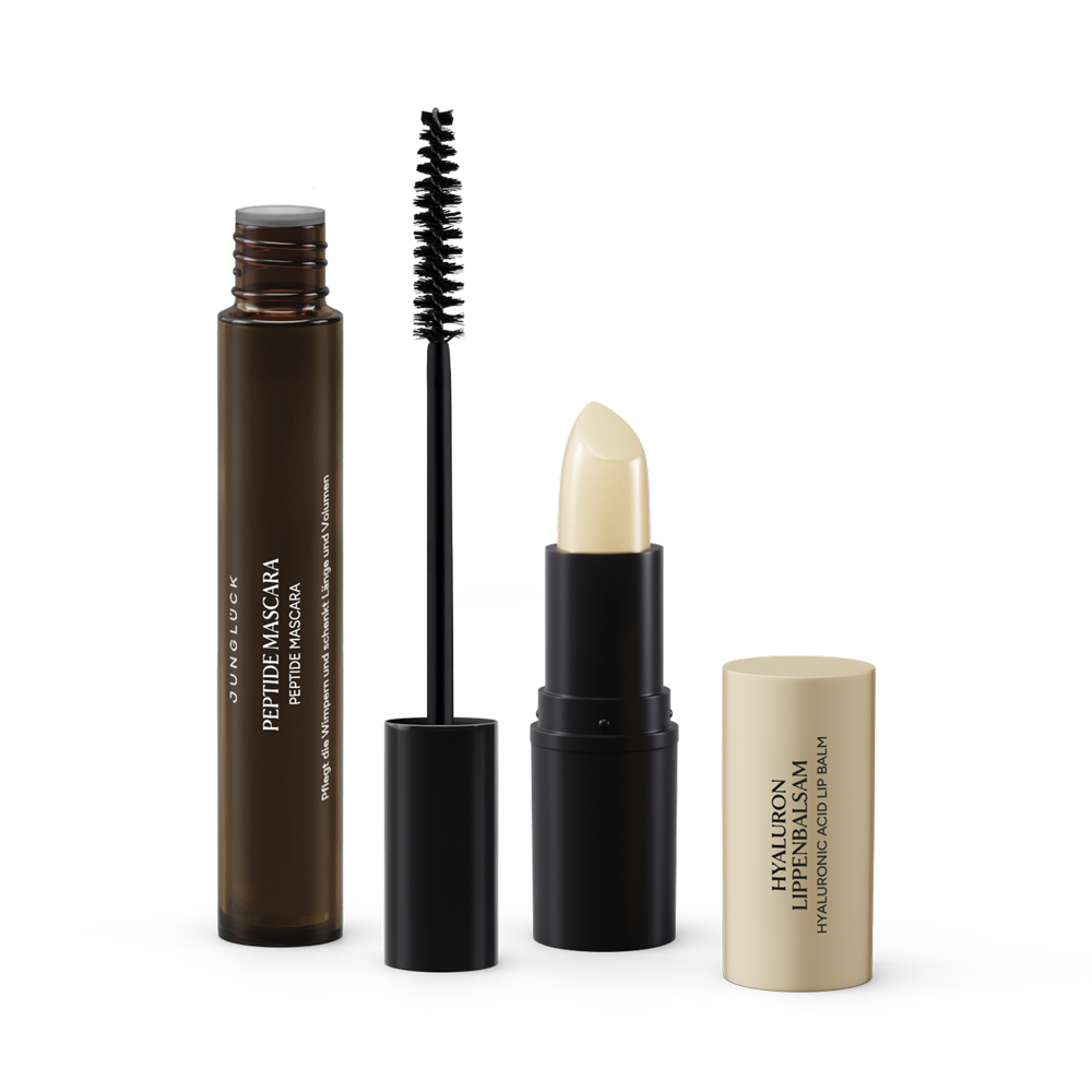 De Beauty Essentials Transparantie-set bestaat uit een peptidemascara in een bruin glazen flesje en een lippenbalsem in een