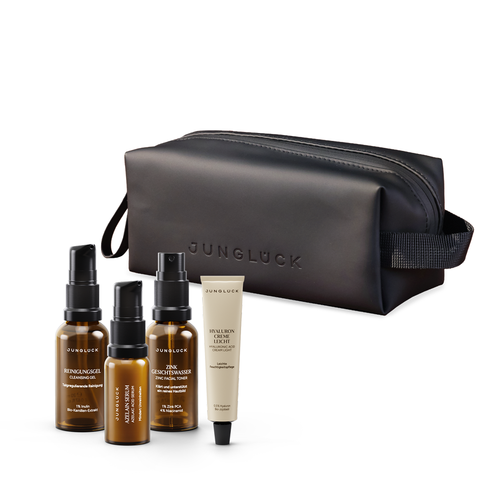 "Bye Bye Breakouts" Starter Kit with a black bag, three amber glass bottles, and a tube.
