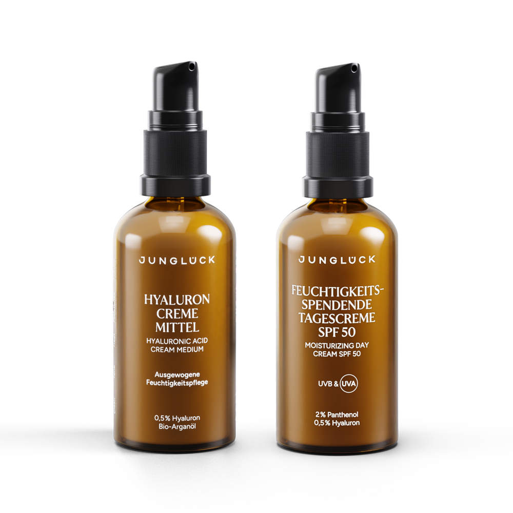 Zwei BRAUNGLASF Flaschen mit Pumpverschluss, eine mit Hyaluron Creme, die andere mit Tagescreme SPF 50.