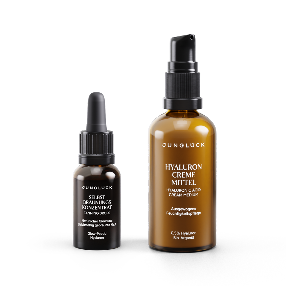 Set "Sonnenverwoehnt" con due flaconi in vetro ambrato: a sinistra il concentrato autoabbronzante e a destra il trattamento "Hyaluron Creme ".